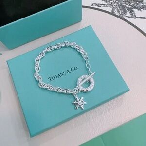 Tiffany & Co. Silver Bracelet with Snowflake Pendant